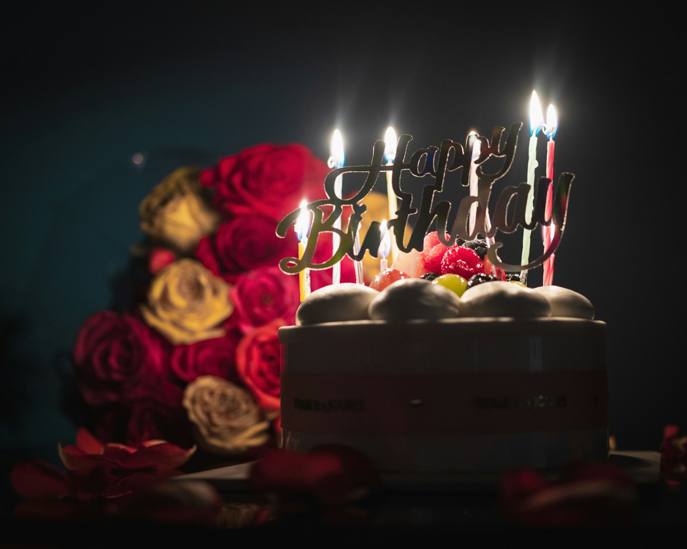 Candlelit birthday cake and roses: debut celebration inspiration